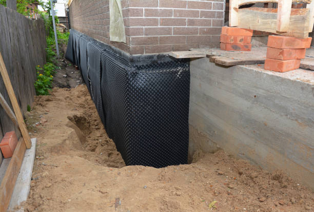 Happy homeowners after waterproofing job in Port Jefferson